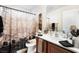 Bathroom featuring single sink, vanity, patterned shower curtain, toilet and decorative accents at 10086 Aspen Rose St # 101, Las Vegas, NV 89183