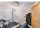 Bedroom featuring a large bed, sliding closet doors and workout equipment at 10086 Aspen Rose St # 101, Las Vegas, NV 89183