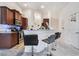 Kitchen showcasing granite countertops with chairs, stainless steel appliances, and wood cabinets at 10086 Aspen Rose St # 101, Las Vegas, NV 89183