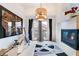 Living space features a modern fireplace, balcony access, and unique decor for a cozy yet stylish ambiance at 10086 Aspen Rose St # 101, Las Vegas, NV 89183