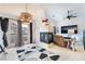 Bright living room featuring a modern fireplace, a balcony door, and stylish decorative elements at 10086 Aspen Rose St # 101, Las Vegas, NV 89183
