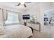 Comfortable main bedroom with a king-size bed, dresser, and TV, offering a relaxing retreat at 10086 Aspen Rose St # 101, Las Vegas, NV 89183