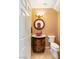 Charming powder room features a vessel sink, decorative mirror, and modern lighting at 10892 Royal Highlands St, Las Vegas, NV 89141