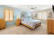 Relaxing bedroom featuring a cozy bed, decorative accents, and natural lighting at 10892 Royal Highlands St, Las Vegas, NV 89141