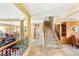 Open entryway with staircase leads to a view of the kitchen, living room, and loft area with a Murphy bed at 10892 Royal Highlands St, Las Vegas, NV 89141
