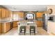 A chef's kitchen featuring granite countertops, stainless steel appliances, and an island at 10892 Royal Highlands St, Las Vegas, NV 89141