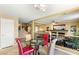 An open concept living area with a decorative railing, tile floors, and stairs at 10892 Royal Highlands St, Las Vegas, NV 89141