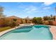Inviting backyard pool with spa, lush landscaping, and sunny skies at 10892 Royal Highlands St, Las Vegas, NV 89141