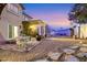 Picturesque backyard with a dining area, gazebo, and beautifully landscaped surroundings at 1465 Via Savona Dr, Henderson, NV 89052