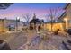 Backyard features a grill, outdoor dining area under a charming gazebo, and a paved patio at 1465 Via Savona Dr, Henderson, NV 89052