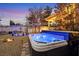 Inviting backyard with a luxurious hot tub and fountain, creating a relaxing and private outdoor oasis at 1465 Via Savona Dr, Henderson, NV 89052