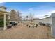 Large backyard with a fountain, hot tub, and covered patio, creating a perfect oasis for relaxation and recreation at 1465 Via Savona Dr, Henderson, NV 89052