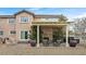 Well-manicured backyard featuring a patio, pergola, and lush landscaping perfect for outdoor relaxation and entertaining at 1465 Via Savona Dr, Henderson, NV 89052