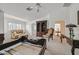 Bright, spacious bedroom with neutral carpet, stylish furniture, and large windows with shutter blinds for privacy at 1465 Via Savona Dr, Henderson, NV 89052