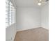Bright bedroom with neutral carpet and shutter blinds for privacy at 1465 Via Savona Dr, Henderson, NV 89052