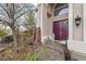 Charming front porch with double doors, lovely stone water feature, and sitting area at 1465 Via Savona Dr, Henderson, NV 89052