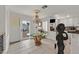 Bright kitchen featuring a glass table and chandelier near the sliding doors at 1465 Via Savona Dr, Henderson, NV 89052