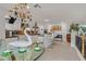 Open-concept kitchen with a swan centerpiece, modern appliances, and white cabinetry at 1465 Via Savona Dr, Henderson, NV 89052