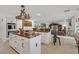Gourmet kitchen with stainless appliances, white cabinetry, and designer countertops at 1465 Via Savona Dr, Henderson, NV 89052