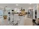 Modern kitchen with stainless steel appliances, white cabinets, and stylish countertops at 1465 Via Savona Dr, Henderson, NV 89052