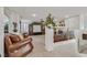 Spacious living room with tile flooring, a fireplace, and plantation shutters at 1465 Via Savona Dr, Henderson, NV 89052