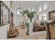 Elegant living room with high ceilings, decorative features, and lots of natural light at 1465 Via Savona Dr, Henderson, NV 89052