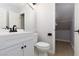 Clean bathroom features white vanity, toilet, and closet at 1501 Scenic Peak St, Las Vegas, NV 89144