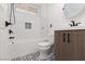 Remodeled bathroom with modern finishes, stylish vanity, and unique tilework at 1501 Scenic Peak St, Las Vegas, NV 89144