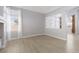 Bright living room features hardwood floors, large windows, and built-in shelving at 1501 Scenic Peak St, Las Vegas, NV 89144