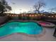 Beautiful backyard pool and hot tub with privacy wall and string lights at 1501 Scenic Peak St, Las Vegas, NV 89144
