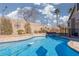 In-ground pool and hot tub with beautiful tile accents and desert landscaping at 1501 Scenic Peak St, Las Vegas, NV 89144