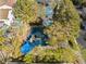 Community offers playground and swimming pools surrounded by trees providing shady recreation areas at 1661 Warrenville St, Las Vegas, NV 89117