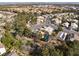 An aerial shot presents this home near green spaces, featuring well-maintained landscaping and community parks at 1661 Warrenville St, Las Vegas, NV 89117