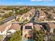 The elevated perspective displays the house's backyard with a pool and neighborhood with mature greenery at 1661 Warrenville St, Las Vegas, NV 89117