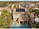 Overhead shot of a home boasting solar panels, a pool, a spa, and a covered patio at 1661 Warrenville St, Las Vegas, NV 89117