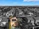 An aerial view showcases this home with solar panels and backyard pool, set in a neighborhood under a sunny sky at 1661 Warrenville St, Las Vegas, NV 89117