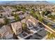 An elevated view displays the home's position within the surrounding neighborhood and the attached two-car garage at 1661 Warrenville St, Las Vegas, NV 89117
