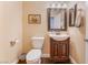 Cozy powder room with vanity and mirrored accents at 1661 Warrenville St, Las Vegas, NV 89117