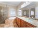 Spacious bathroom features double sinks, granite counters, soaking tub, and a walk-in shower at 1661 Warrenville St, Las Vegas, NV 89117