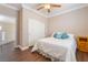 Bedroom featuring warm neutral colors, wood-look flooring, and bright natural light at 1661 Warrenville St, Las Vegas, NV 89117