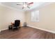 Bedroom features a ceiling fan, wood floors, and a window with shutters at 1661 Warrenville St, Las Vegas, NV 89117