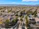An impressive aerial view showcases a neighborhood entrance with lush landscaping, providing an inviting entry at 1661 Warrenville St, Las Vegas, NV 89117