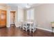 Dining area features wood floors, white furniture, plantation shutters for great natural light at 1661 Warrenville St, Las Vegas, NV 89117