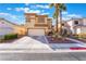 Charming two-story home with a well-manicured lawn and a spacious driveway at 1661 Warrenville St, Las Vegas, NV 89117