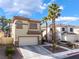 Charming two-story home with a well-manicured lawn and a spacious driveway at 1661 Warrenville St, Las Vegas, NV 89117