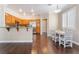 Open-concept kitchen with wood cabinets, stainless steel appliances, granite countertops, and adjacent dining area at 1661 Warrenville St, Las Vegas, NV 89117