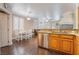 View of open layout shows kitchen with breakfast bar looking into dining and living area at 1661 Warrenville St, Las Vegas, NV 89117
