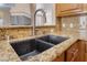 Close up of kitchen sink and granite countertop at 1661 Warrenville St, Las Vegas, NV 89117