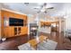 Inviting living room with fireplace, hardwood floors, and built-in media center, perfect for entertaining at 1661 Warrenville St, Las Vegas, NV 89117