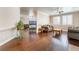 Open-concept living room with hardwood floors and a cozy fireplace feature at 1661 Warrenville St, Las Vegas, NV 89117